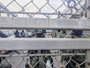 Law enforcement at Delaney Hall closely guarded a gate on Thursday after four detainees escaped during an uprising in the facility.