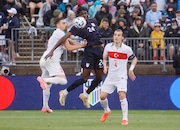 United States forward Patrick Agyemang (24) leaps for the ball between Turkey's Demiral Merit (3) and Söyüncü Çaglar (4) during the first half of an international friendly soccer game, Saturday, June 7, 2025, in East Hartford, Conn. (AP Photo/Mary Schwalm)