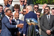 President Donald Trump shakes hands with running back Saquon Barkley, as he welcomes the Super Bowl champion Philadelphia Eagles NFL football team to the South Lawn of the White House, Monday, April 28, 2025, in Washington. (AP Photo/Mark Schiefelbein)