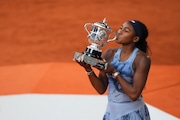 Coco Gauff of the U.S. kisses the trophy after winning the final match of the French Tennis Open against Aryna Sabalenka of Belarus at the Roland-Garros stadium in Paris, Saturday, June 7, 2025. (AP Photo/Lindsey Wasson)