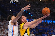 Indiana Pacers guard T.J. McConnell (9) shoots as Oklahoma City Thunder forward Kenrich Williams, left, defends during the second half of Game 5 of the NBA Finals basketball series, Monday, June 16, 2025, in Oklahoma City.