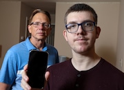 Marty Michalak and his son Tim Michalak with the retuned iPhone in Hilsborough, NJ on Tuesday, June 3, 2025