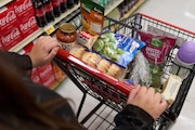 FILE - Jaqueline Benitez, who depends on California's SNAP benefits to help pay for food, shops for groceries at a supermarket in Bellflower, Calif., on Feb. 13, 2023. (AP Photo/Allison Dinner, File)