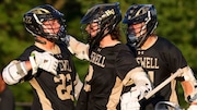 Luke Caldwell (22) celebrates with Gavin Seibold (2) and Johnny Ellis (34) of Hopewell Valley after scoring a goal against Notre Dame during the boys lacrosse Colonial Valley Conference Final at Hopewell Valley Central High School in Pennington, NJ on Thursday, May 15, 2025