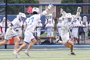 Garrett Ferguson (8) of Westfield celebrates with Chris Davies (9) and Billy Gerne (27) after scoring the game winning goal in double overtime to defeat Summit 8-7 in the boys lacrosse Kirst Cup semifinal at Kean University in Union, NJ on Tuesday, June 17, 2025.