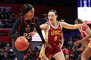 Rutgers Scarlet Knights forward Zachara Perkins (22) looks to dribble past USC Trojans guard Kayleigh Heckel (9) during the first half of an NCAA women’s basketball game at Jersey Mikes Arena in Piscataway, NJ on Sunday, January 5, 2025.