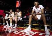 Rutgers senior Zach Martini (99, l to r) sits on the bench with freshmen guard Dylan Harper (2) and guard Ace Bailey (4) during player introductions before the Scarlet Knights play Minnesota in Piscataway, N.J., Sunday, March 9, 2025. This is the last game of the season here at Jersey Mike’s Arena.