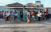 Yappy hours where dogs run free and owners can drink and socialize outside in separate isolated area at Wonder Bar in Asbury Park, N.J., Saturday, June, 8, 2019