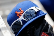 A New York Mets caps sits on the dugout steps during an exhibition spring training baseball game between the St. Louis Cardinals and the New York Mets Sunday, March 10, 2013, in Jupiter, Fla. The Mets won 3-0. (AP Photo/Jeff Roberson)