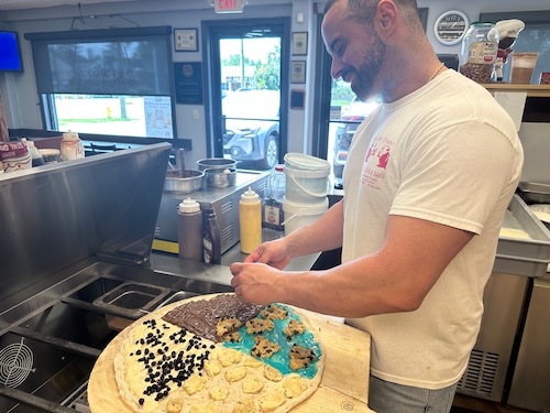 Owner Pietro Mazzella of Brother Bruno's Pizza making a dessert pie